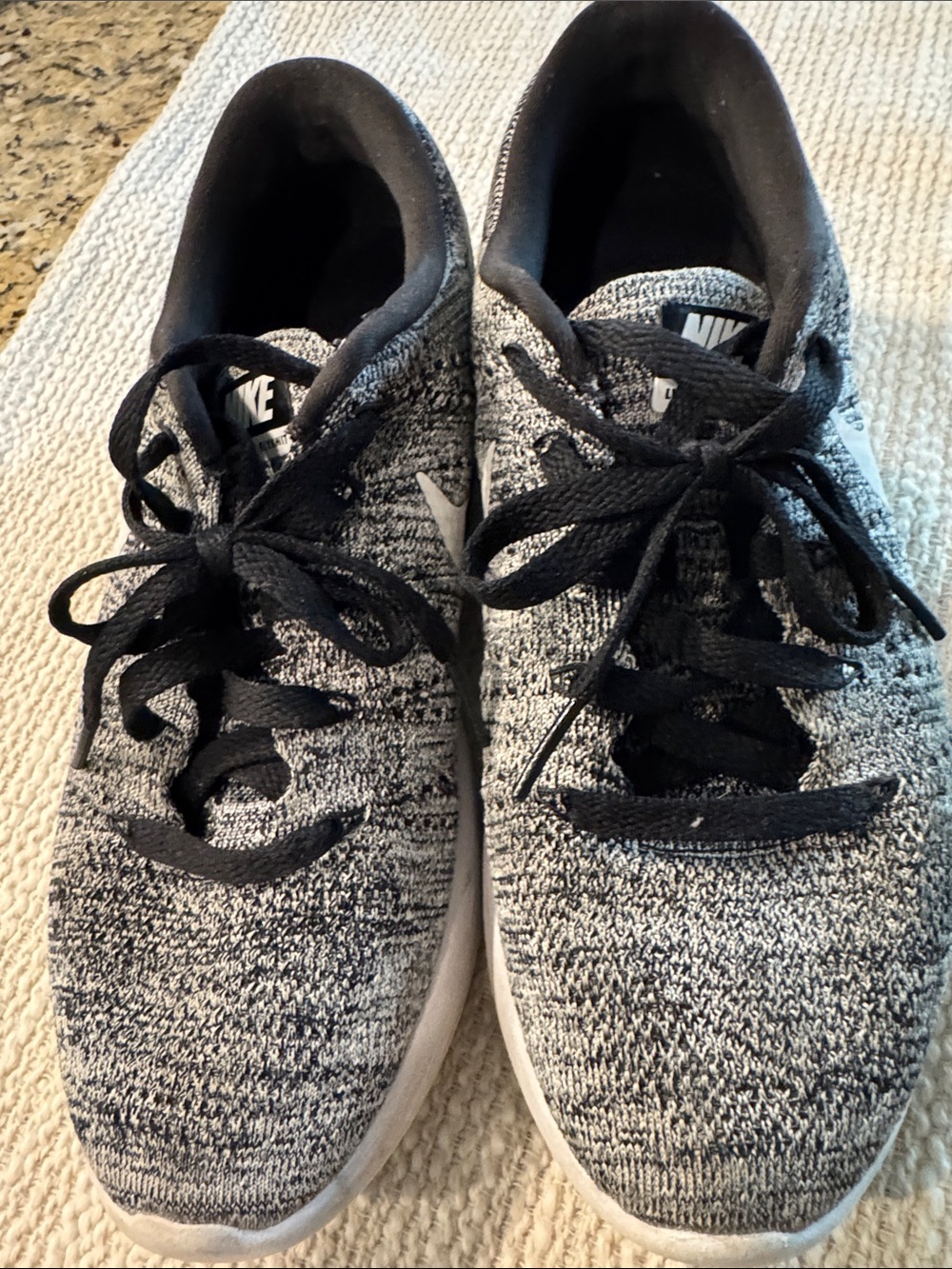 Nike Lunarlon black and gray knit ladies shoes.